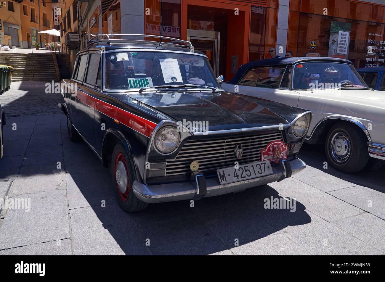 16-06-2013 Segovia, Spain - A vintage SEAT taxi, black and red, stands out at an antique car gathering Stock Photo