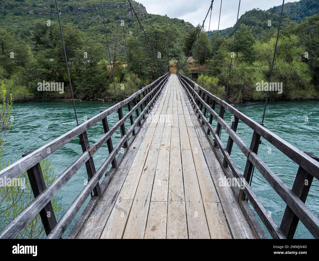 Suspension bridge over river Futaleufu, at school Escuela Rural Las Escalas, Chile. Stock Photo