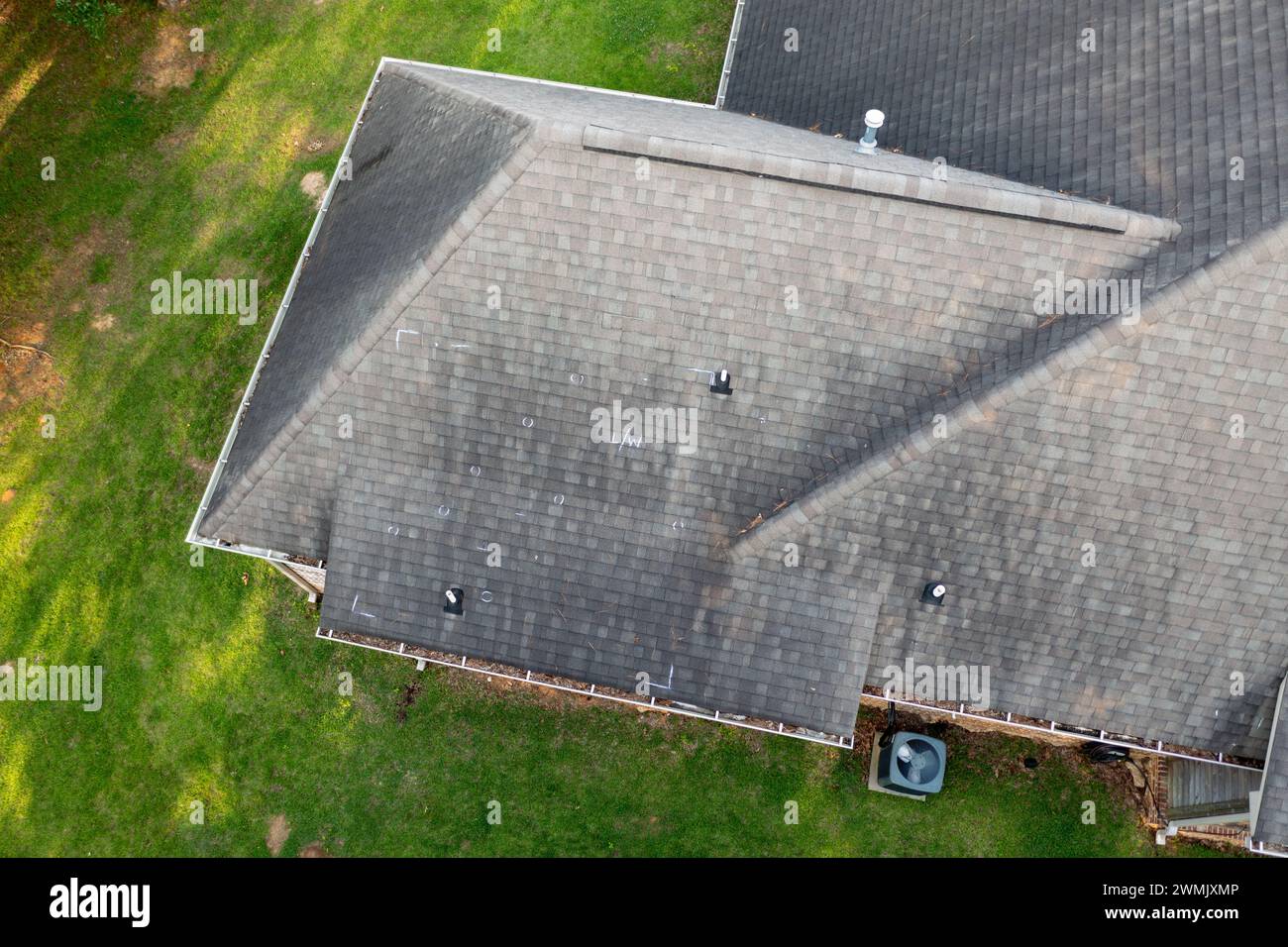 Roof with hail damage and chalk markings from inspection Stock Photo