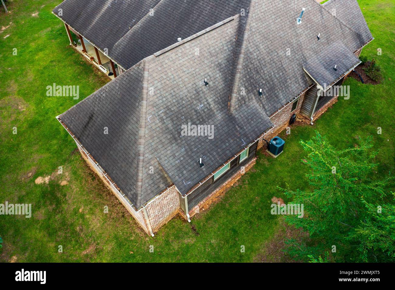 Roof with hail damage and chalk markings from inspection Stock Photo