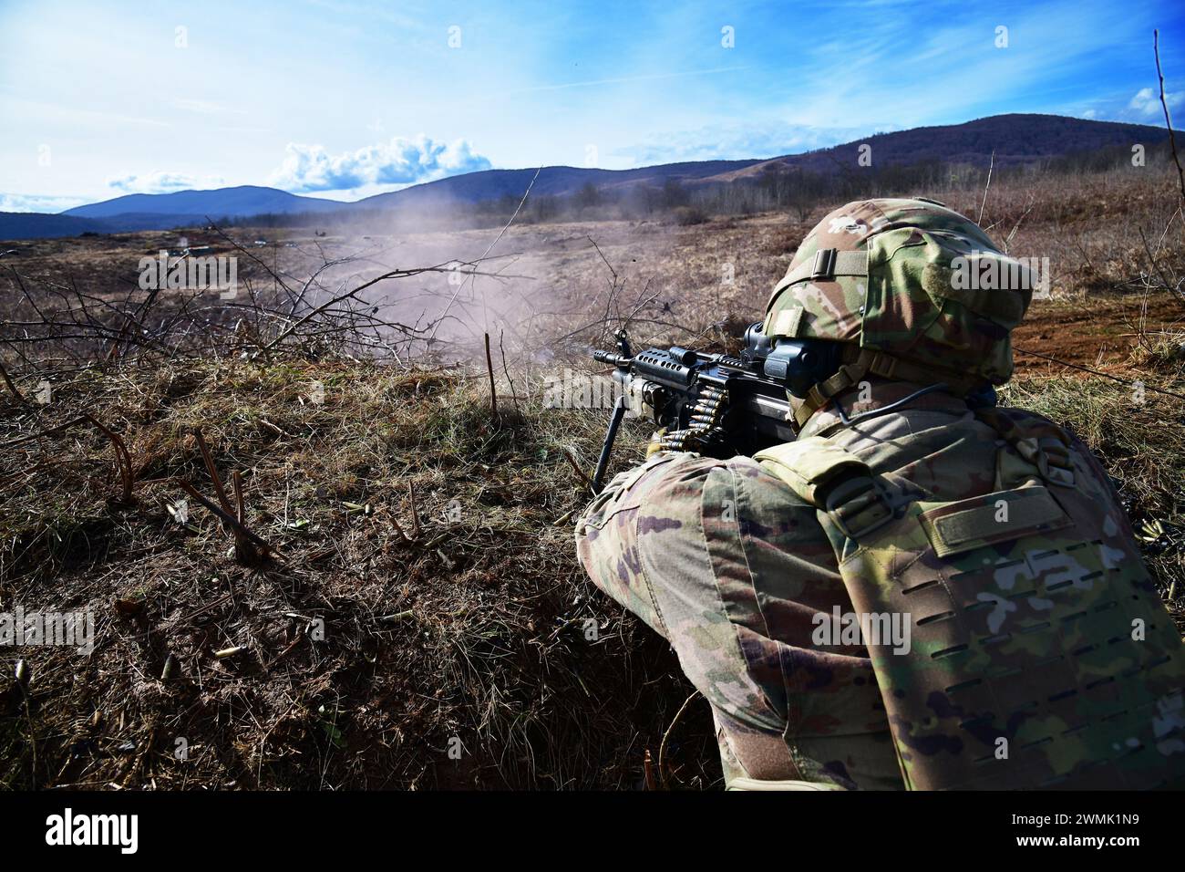 A U.S. Army Paratroopers assigned to the 1st Battalion, 503rd Infantry Regiment, 173rd Airborne Brigade, shoots a target with the M249 light machine gun during team live-fire and tactical movement training as part of Eagle Ursa at the training range in Slunj, Croatia, Feb. 25, 2024. The 173rd Airborne Brigade is the U.S. Army's Contingency Response Force in Europe, providing rapidly deployable forces to the United States European, African, and Central Command areas of responsibility. Forward deployed across Italy and Germany, the brigade routinely trains alongside NATO allies and partners to b Stock Photo
