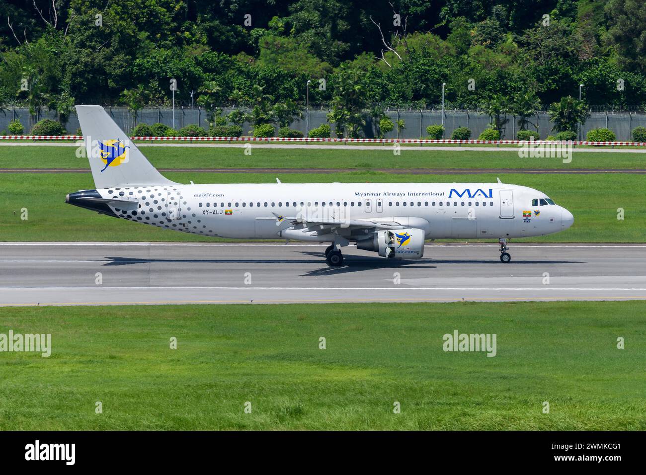 Myanmar Airways International Airbus A320 landing. Plane A320 of Myanmar Airways airline. Stock Photo