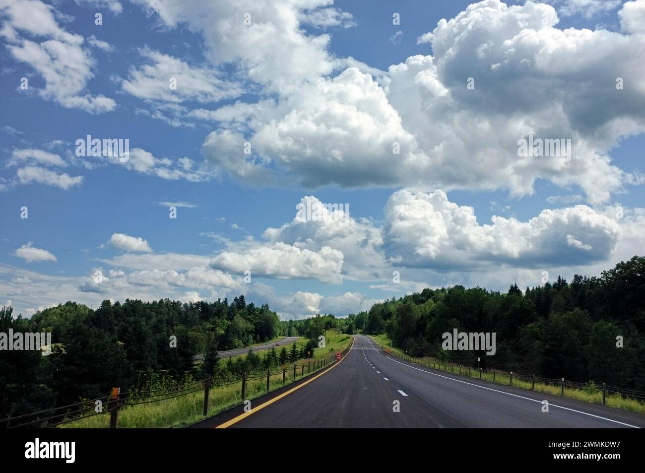 Paved road in the Quebec countryside, heading south on route 55, just before the US border; Quebec, Canada Stock Photo