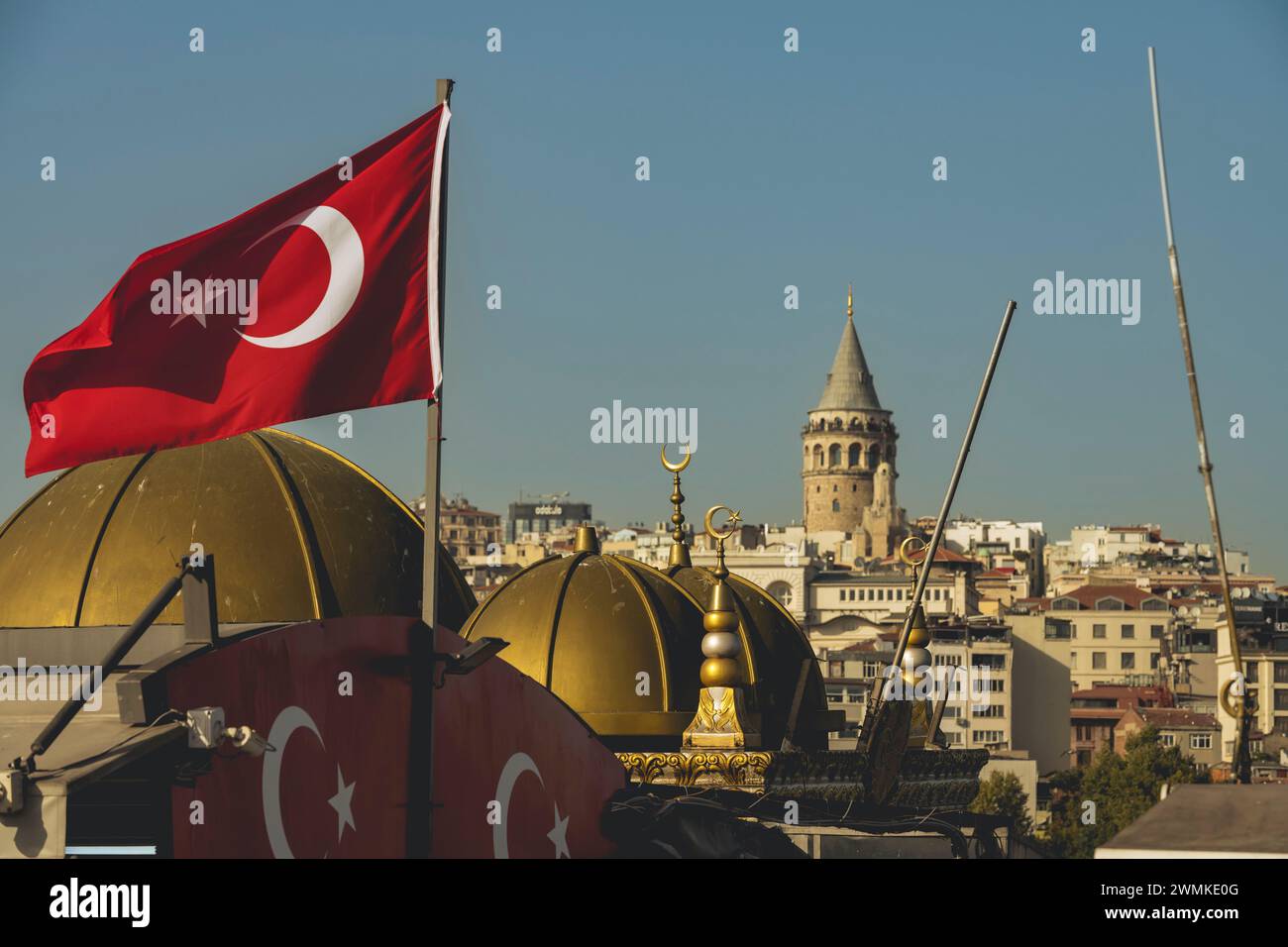 Galata Tower and the national flag of Turkey in Beyoglu; Istanbul, Turkey Stock Photo
