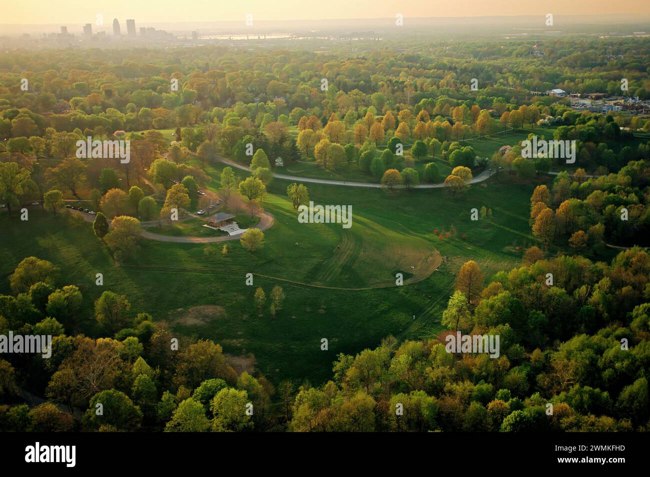 Aerial view over 409-acre Cherokee Park, designed in 1891 by Frederick Law Olmsted in the east side of Louisville, Kentucky. Baringer Hill in the s... Stock Photo