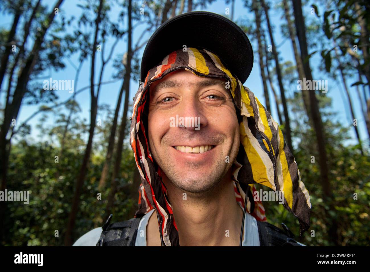 Outdoor portrait of a man with a colourful headscarf; Hell Ville, Nosy ...