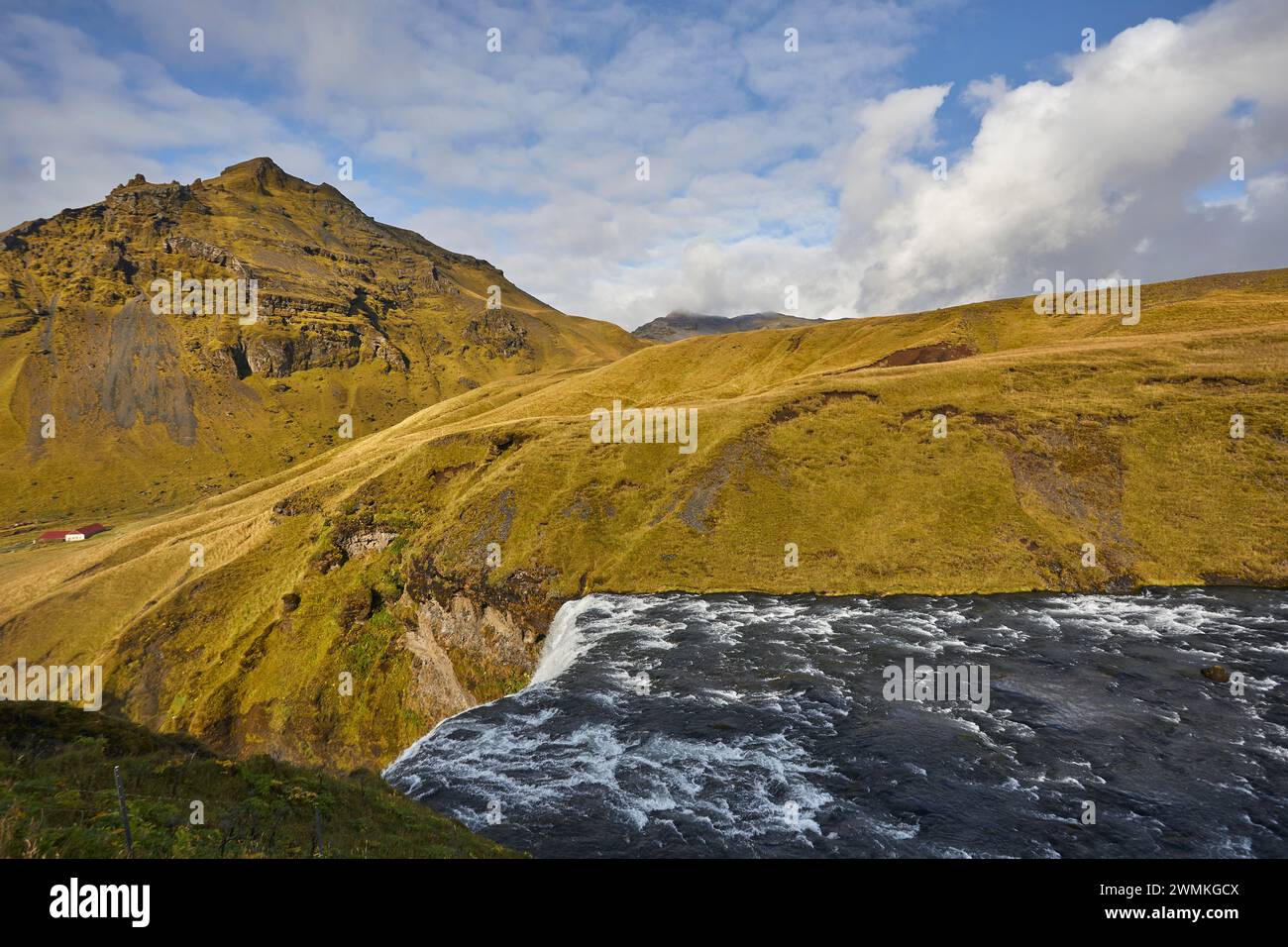 Top of Skogafoss Falls and green vegetation in Southern Iceland; Iceland Stock Photo
