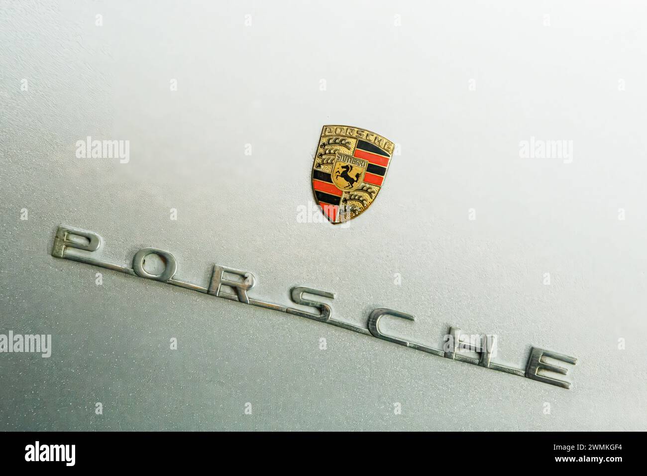 Close up of silver Porsche Spyder Sportscar emblem with copy space Stock Photo