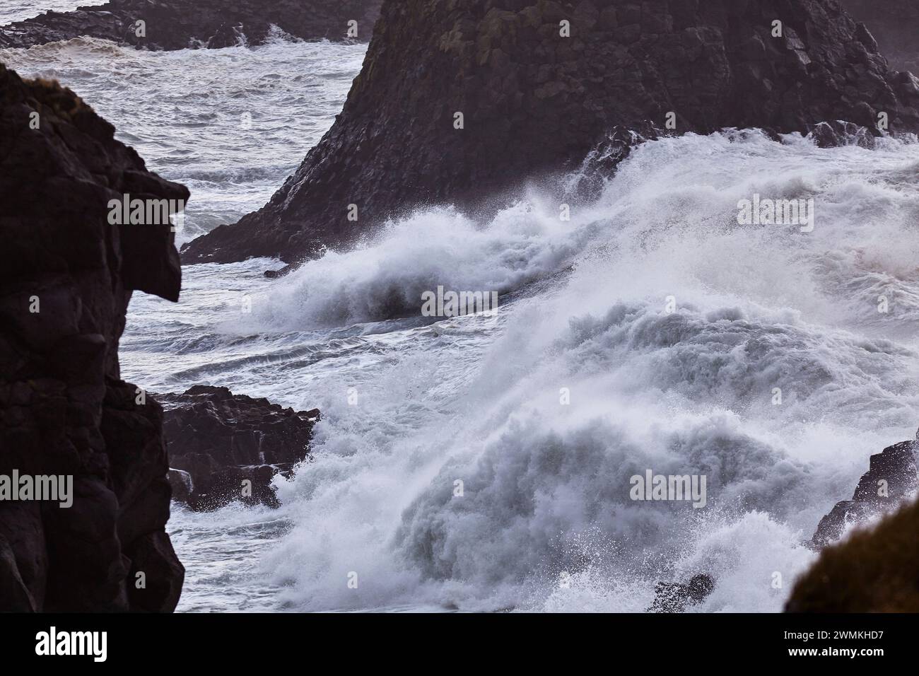 Storm surf along a rugged coastline with black rock at Arnastapi, Snaefellsnes peninsula, west coast of Iceland; Iceland Stock Photo