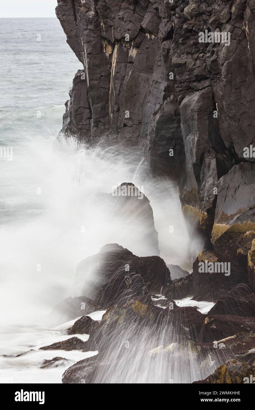 Surf breaks on the cliffs at Skardsvik, Snaefellsnes peninsula, west coast of Iceland; Skalasnagi, Iceland Stock Photo