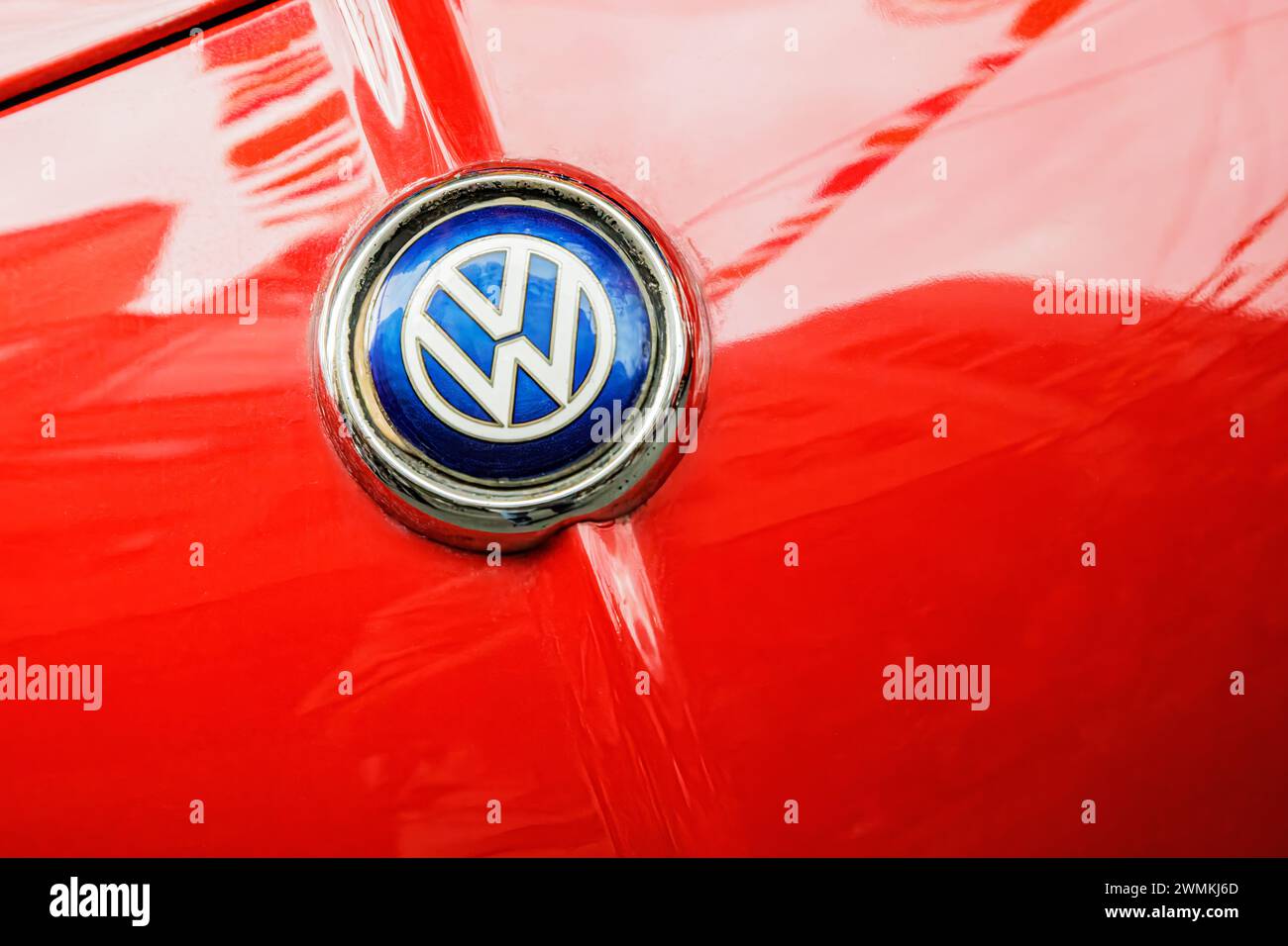 Close up of a Red Vlokswagen Beetle emblem on front of a German car with copy space Stock Photo