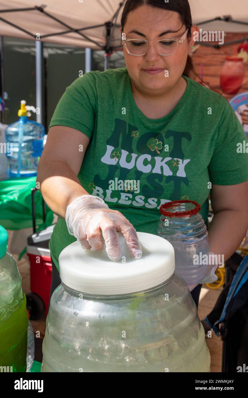 Vendor gets a traditional Mexican drink at the El Barrilito 956 booth at the South Texas Irish Fest 2024, McAllen, Texas, USA. Stock Photo