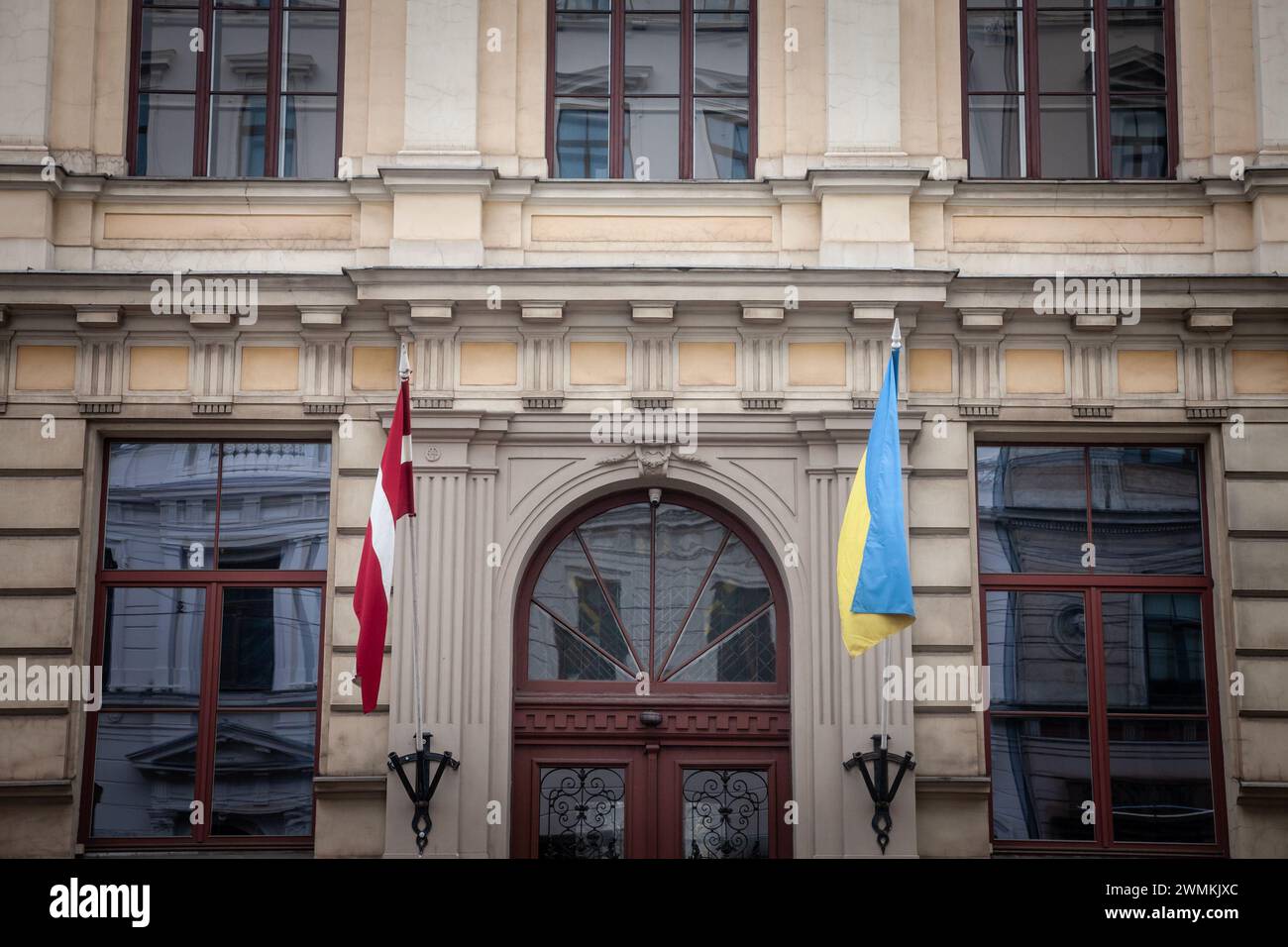 Picture of the dutch and Latvian flags waiving together in Riga, celebrating the solidarity between Latvia and Ukraine in the war against russia. Stock Photo