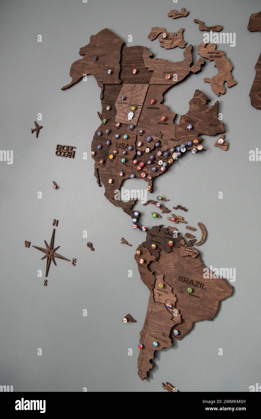 Wooden Travel map North and South America, flag pins for travel destinations Stock Photo