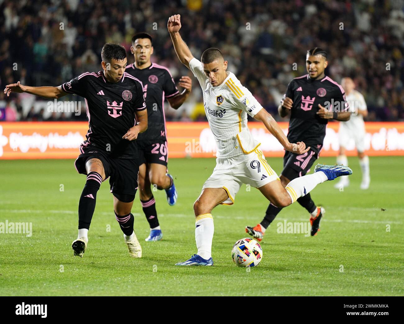 Carson, California, USA. 25th Feb, 2024. Los Angeles Galaxy forward DEJAN JOVELJIC (9) takes a shot on goal with Inter Miami midfielder TOMAS AVILES (6), Inter Miami midfielder DIEGO GOMEZ (20), and Inter Miami defender DEANDRE YEDLIN (2) defending at Dignity Health Sports Park. (Credit Image: © Jose Moreno/ZUMA Press Wire) EDITORIAL USAGE ONLY! Not for Commercial USAGE! Stock Photo