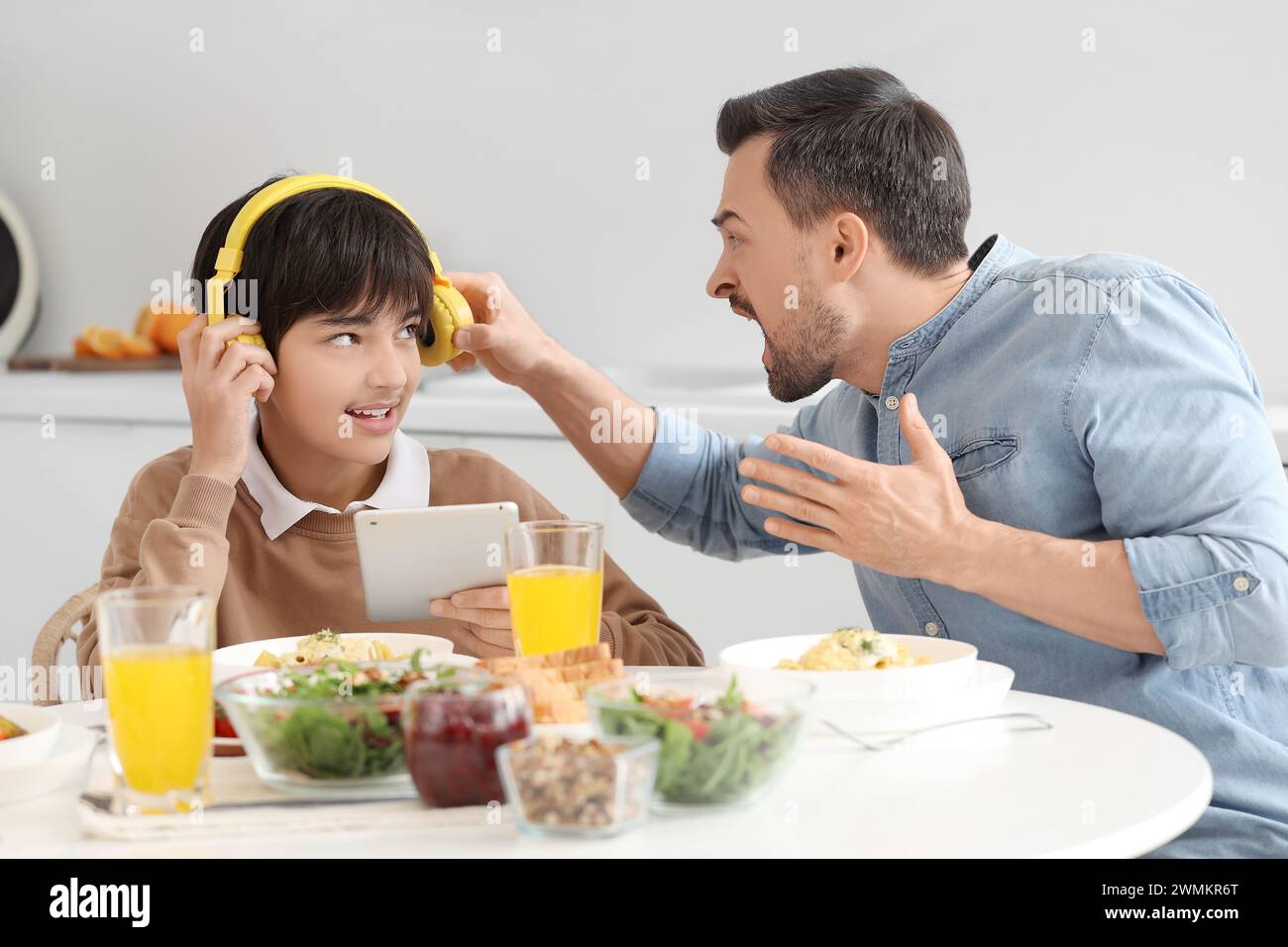 Teenage boy dinner table worried hi-res stock photography and images