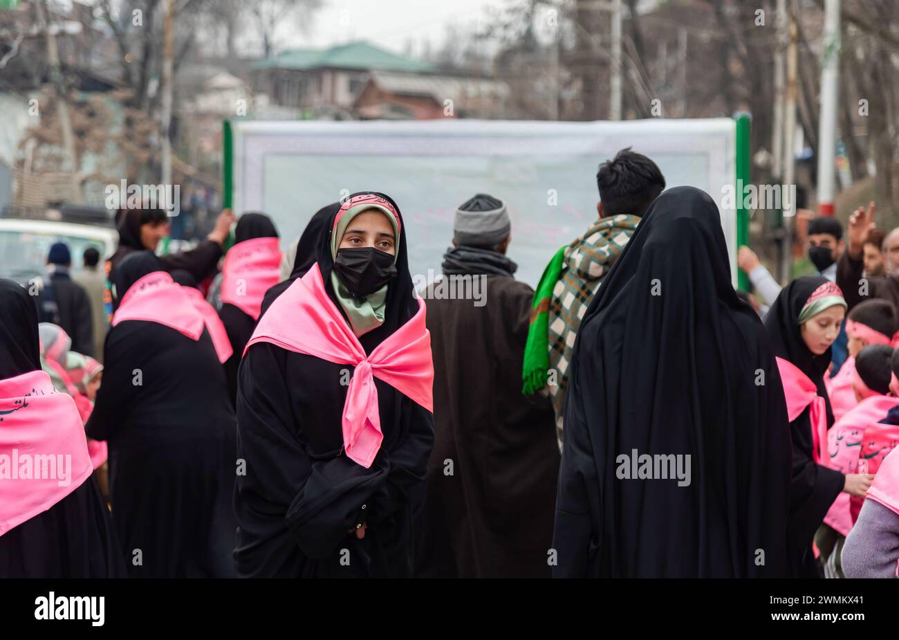 Budgam, India. 26th Feb, 2024. Kashmiri Shia Muslims walk while ...