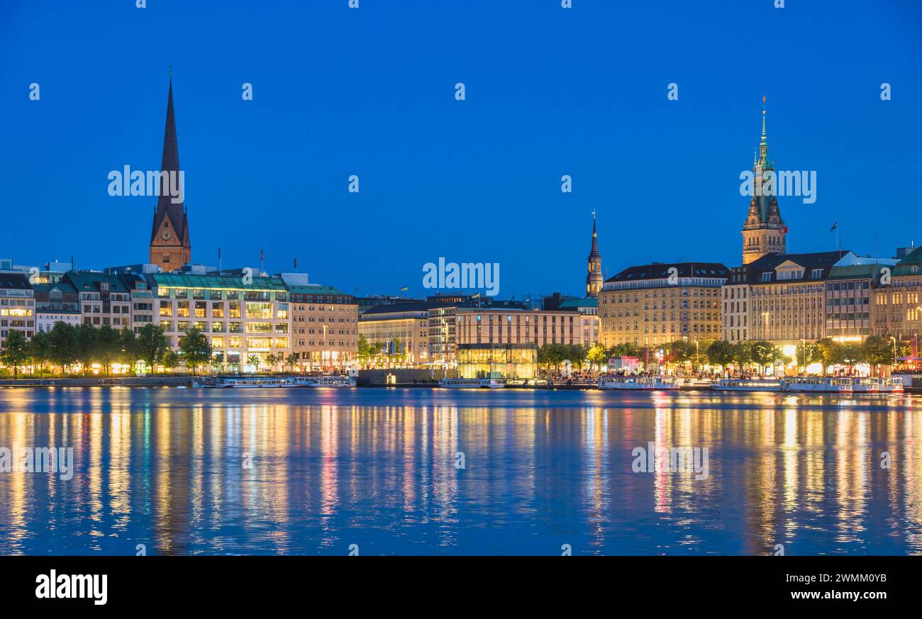 Hamburg Germany, night panorama city skyline at Alster Lake with Fountain Stock Photo