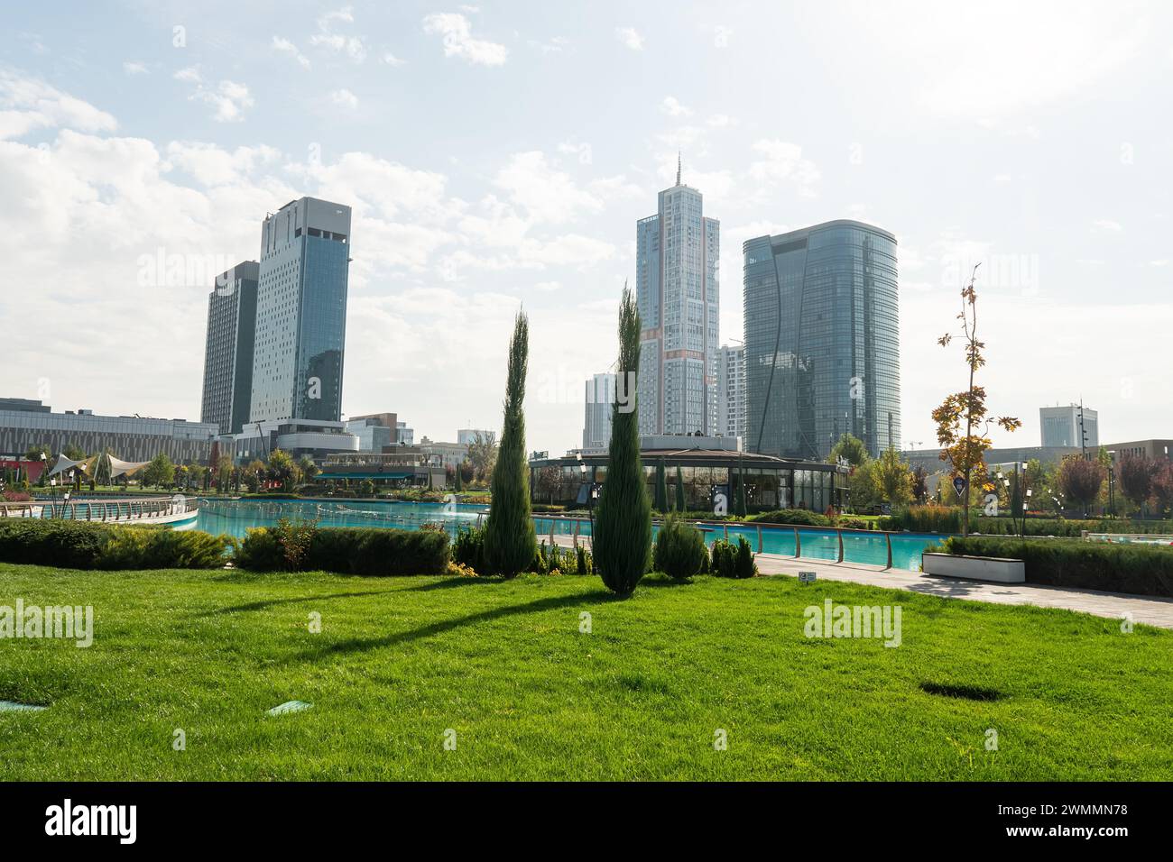 Awesome view of contemporary buildings reflected in pool of Tashkent ...