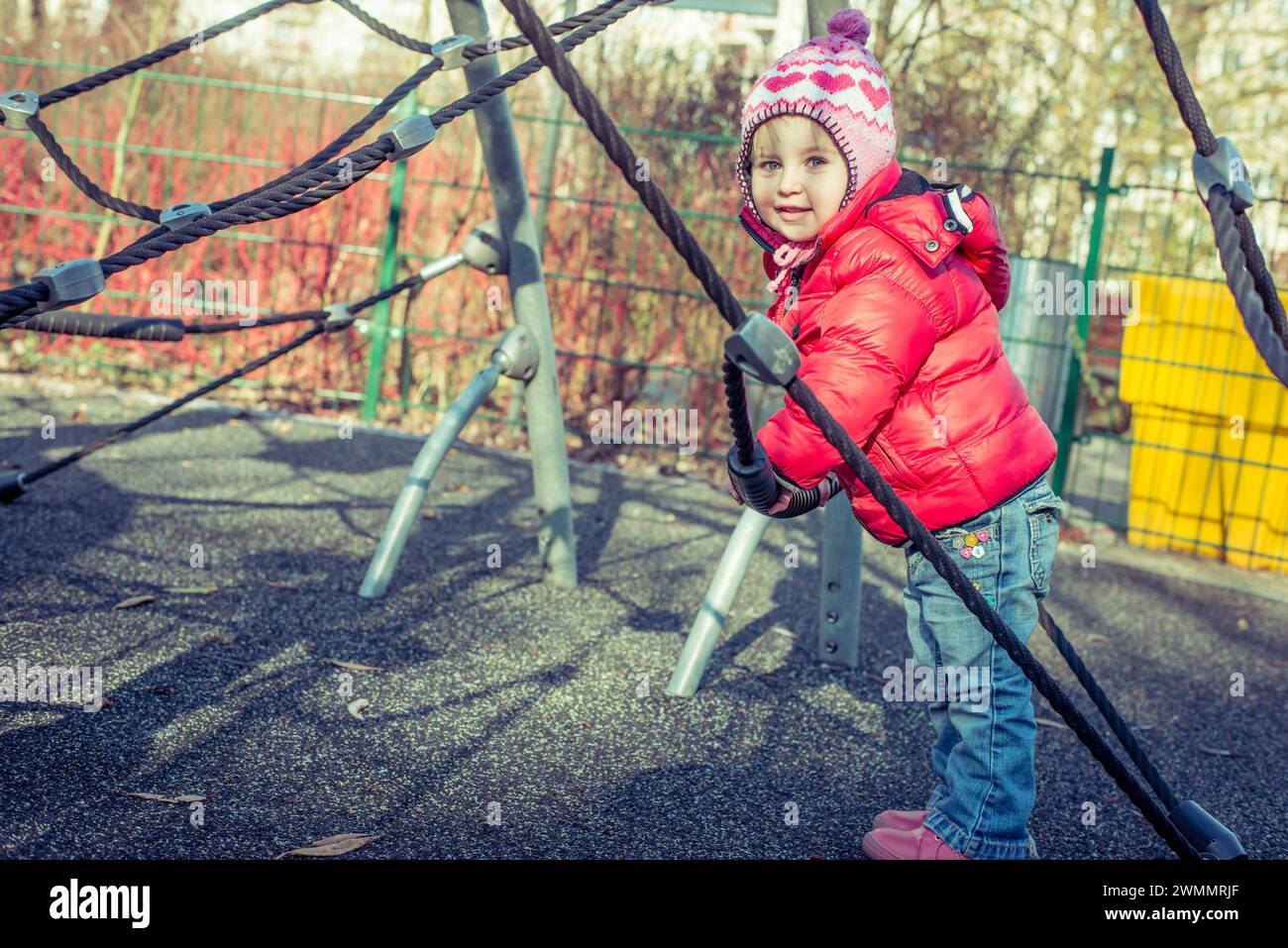 little cute girl playing at the playground in autumn Stock Photo - Alamy