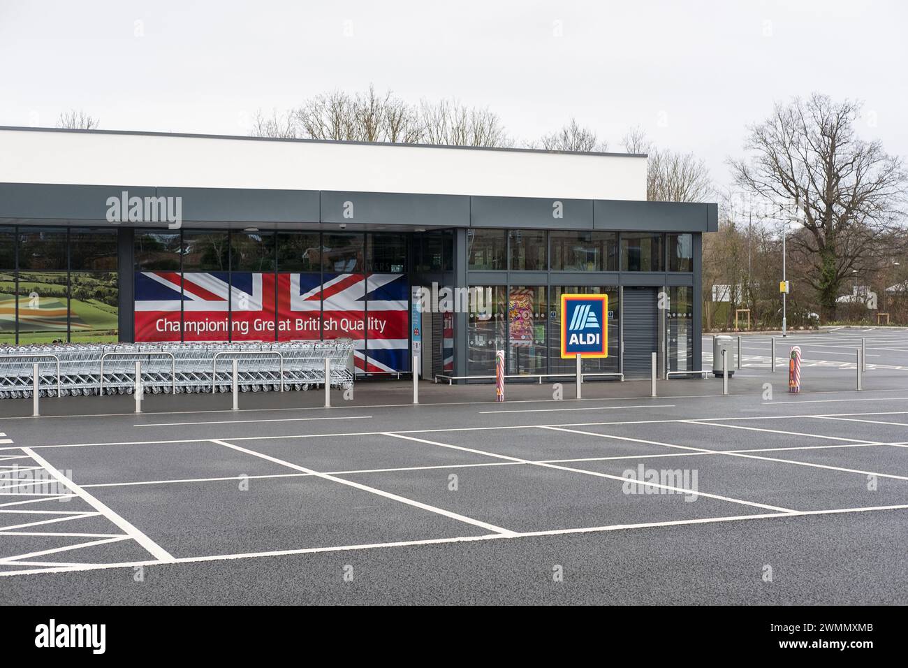 Views towards the empty parking lot and the supermarket large windows displaying photo