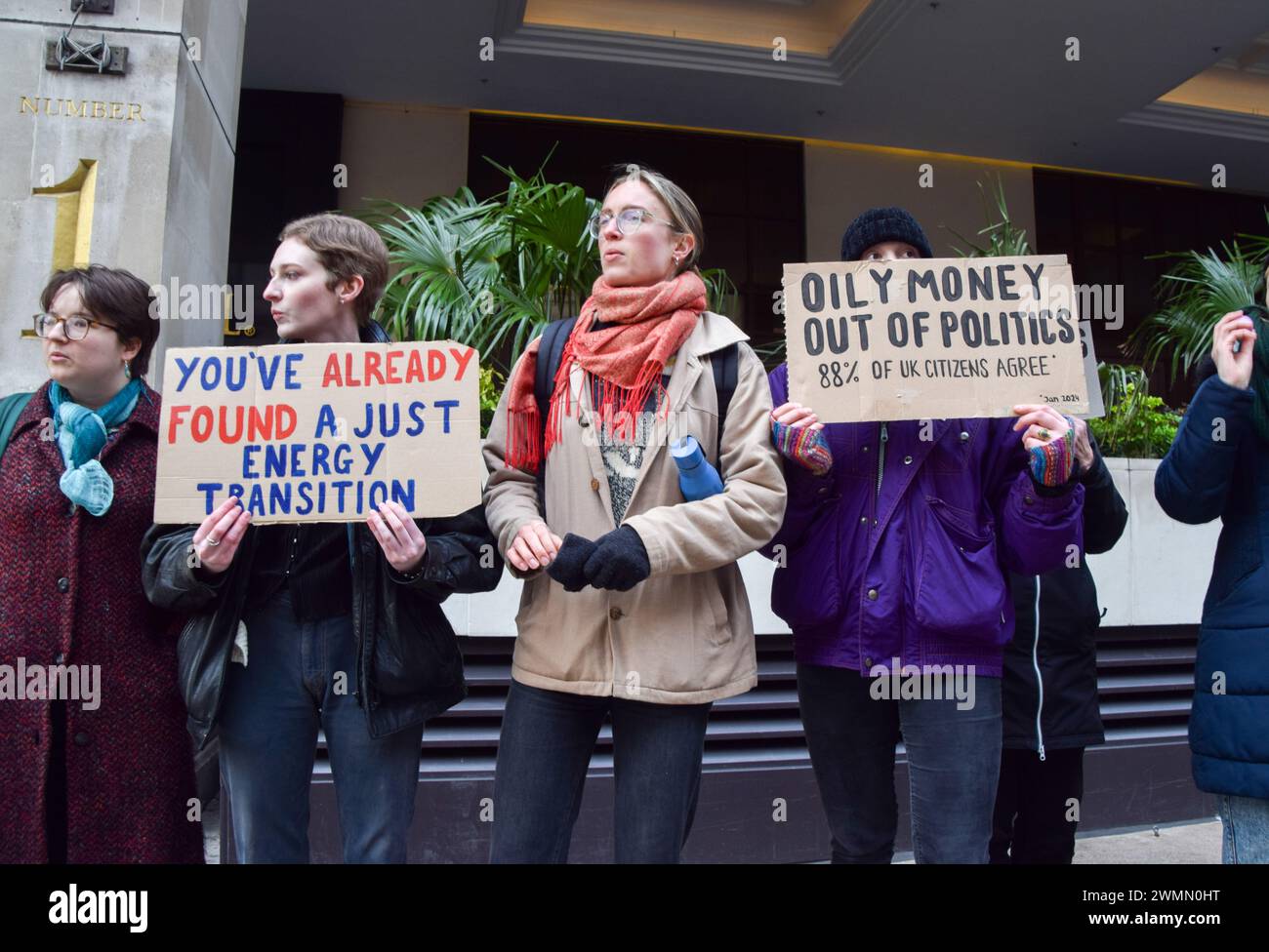 London, UK. 27th February 2024. Protesters from the climate activist group Fossil Free London gather outside Intercontinental in Park Lane as International Energy Week, a conference attended by major fossil fuel companies, begins. Credit: Vuk Valcic/Alamy Live News Stock Photo