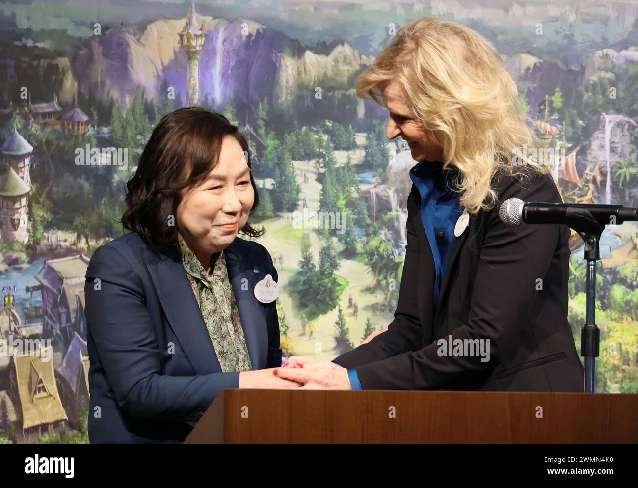Urayasu, Japan. 27th Feb, 2024. Tokyo Disney Resort operator Oriental Land chairwoman and CEO Yumiko Takano (L) shakes hands with Disney Parks International president Jill Estorino (R) as they announce overview of the DisneySea's new area 'Fantasy Springs' in Urayasu, suburban Tokyo on Tuesday, February 27, 2024, 100 days before of the opening of the new facilities. The Fantasy Springs has three attractions of Frozen Kingdom, Rapunzel's Forest, Peter Pan's Never Land and a luxury hotel Fantasy Springs Hotel. Credit: Aflo Co. Ltd./Alamy Live News Stock Photo