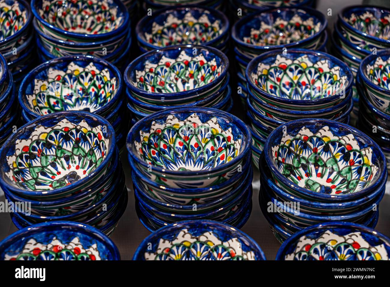 Bukhara. Uzbekistan. Shopping place. Ceramic cups and bowls decorated by traditional uzbek patterns. Blue pattern. lots of cups of blue color on the b Stock Photo