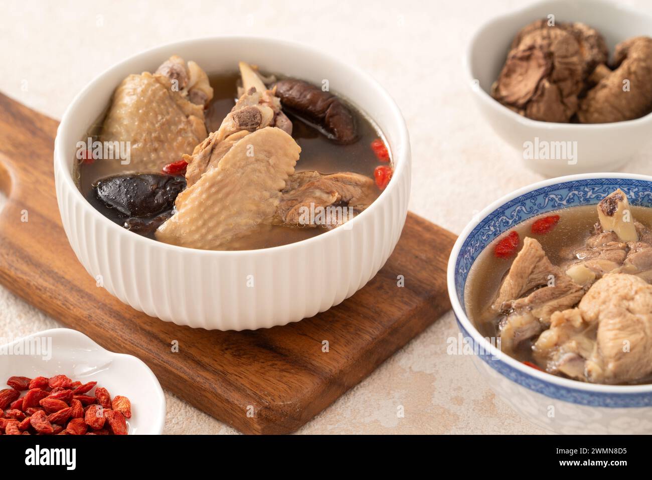 Delicious Taiwanese shiitake mushroom chicken soup in a bowl on white table background. Stock Photo
