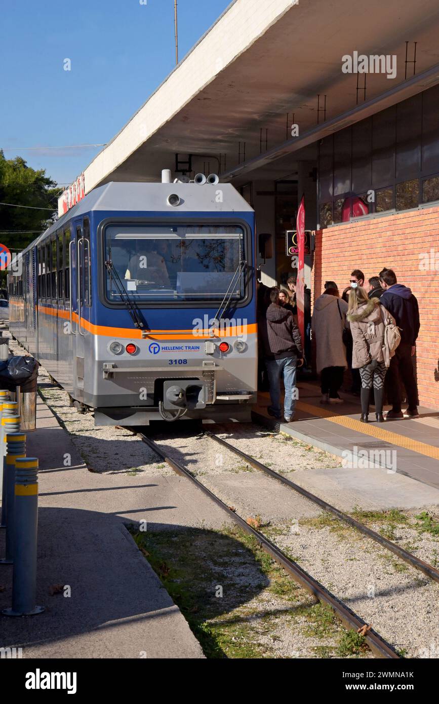 Passengers getting on a diesel railcar of the Diakopto rack railway at the main station in  Diakopto, Peloponnese, Greece, May 2023 Stock Photo