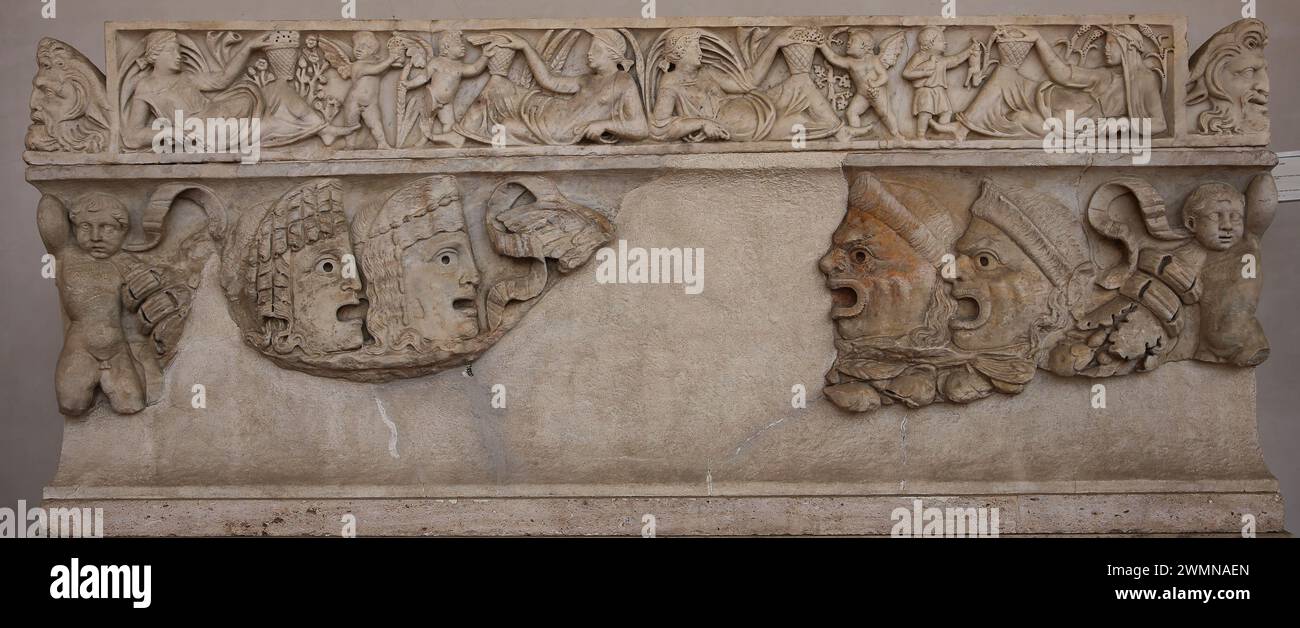 Sarcophagus decoretated with garlands, cupid and theatrical masks. Lid decorated with seasons. 2nd century. National Roman Museum (Baths Diocletian). Stock Photo