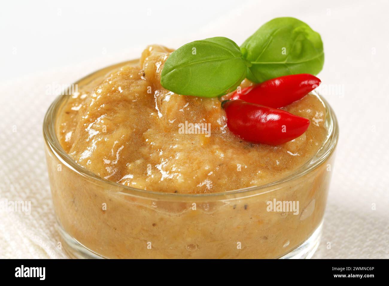 Eggplant (aubergine) dipping sauce or spread in small glass dish Stock Photo