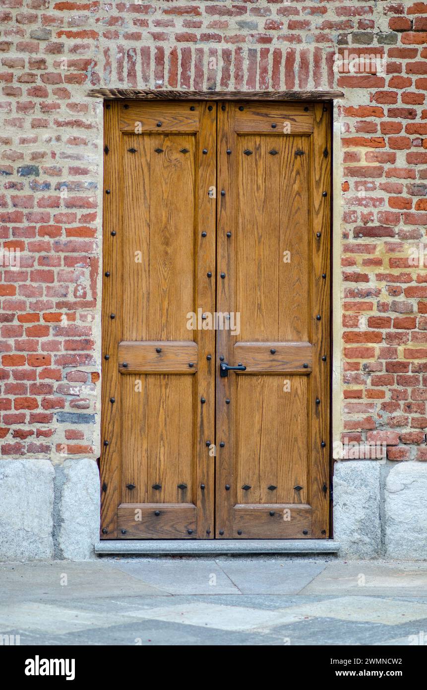 Door in precious wood, entrance to an elegant old building. Stock Photo