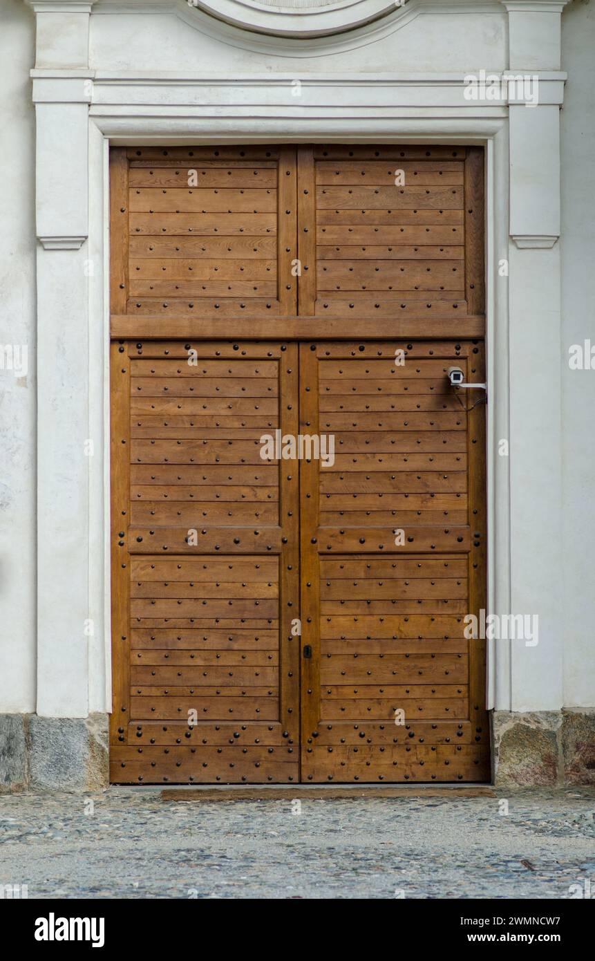 Door in precious wood, entrance to an elegant old building. Stock Photo