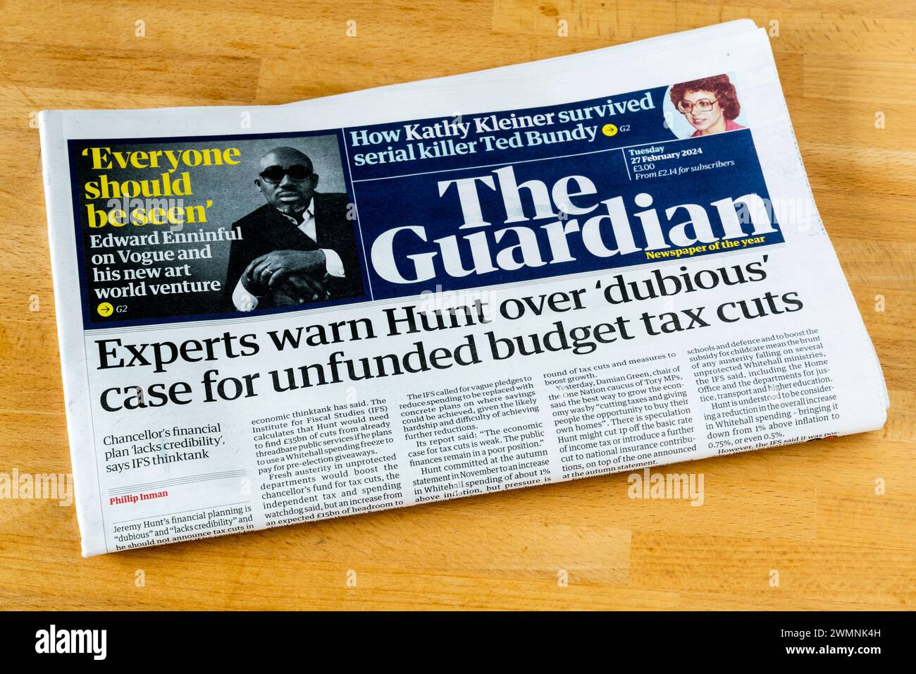 27 Feb 2024. Guardian headline reads: Experts warn Hunt over 'dubious' case for unfunded budget tax cuts. Stock Photo