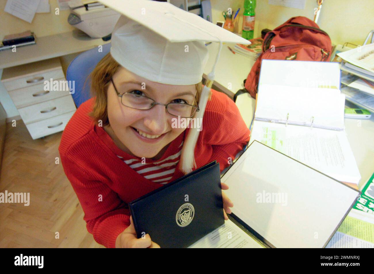 an university degree certificate, a diplom or diploma after graduating university degree certificate, diplom or diploma Stock Photo