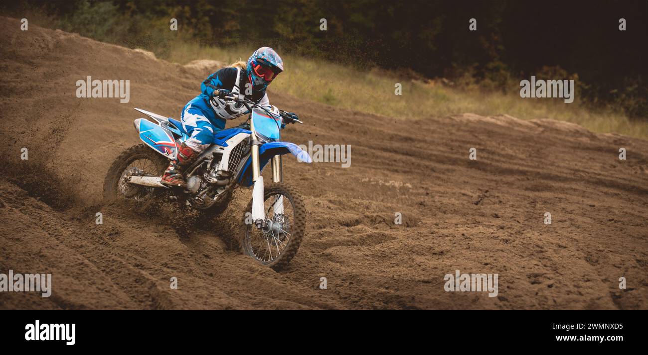 24 september 2016 - Volgsk, Russia, MX moto cross racing - Girl Bike Rider rides on a motorcycle and throwing a spray of dirt Stock Photo