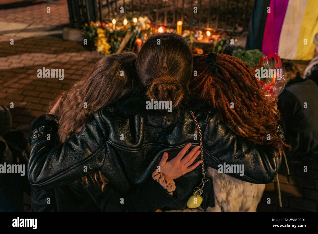 People hold a vigil outside The Stonewall Inn to mourn the death of ...