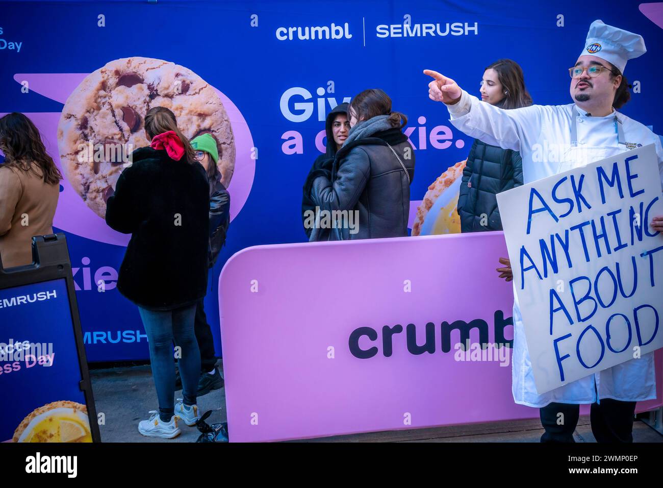 Cookie lovers rush to the Crumbl store in Chelsea in New York on Friday, February 16, 2024 to celebrate Saturday’s Random Acts of Kindness Day. Partnering with Semrush, a SaaS analysis platform, they are giving out thousands of cookies, two for each person. Recipients are urged to keep one cookie for themselves and to give away the other as a random act of kindness. (© Richard B. Levine) Stock Photo