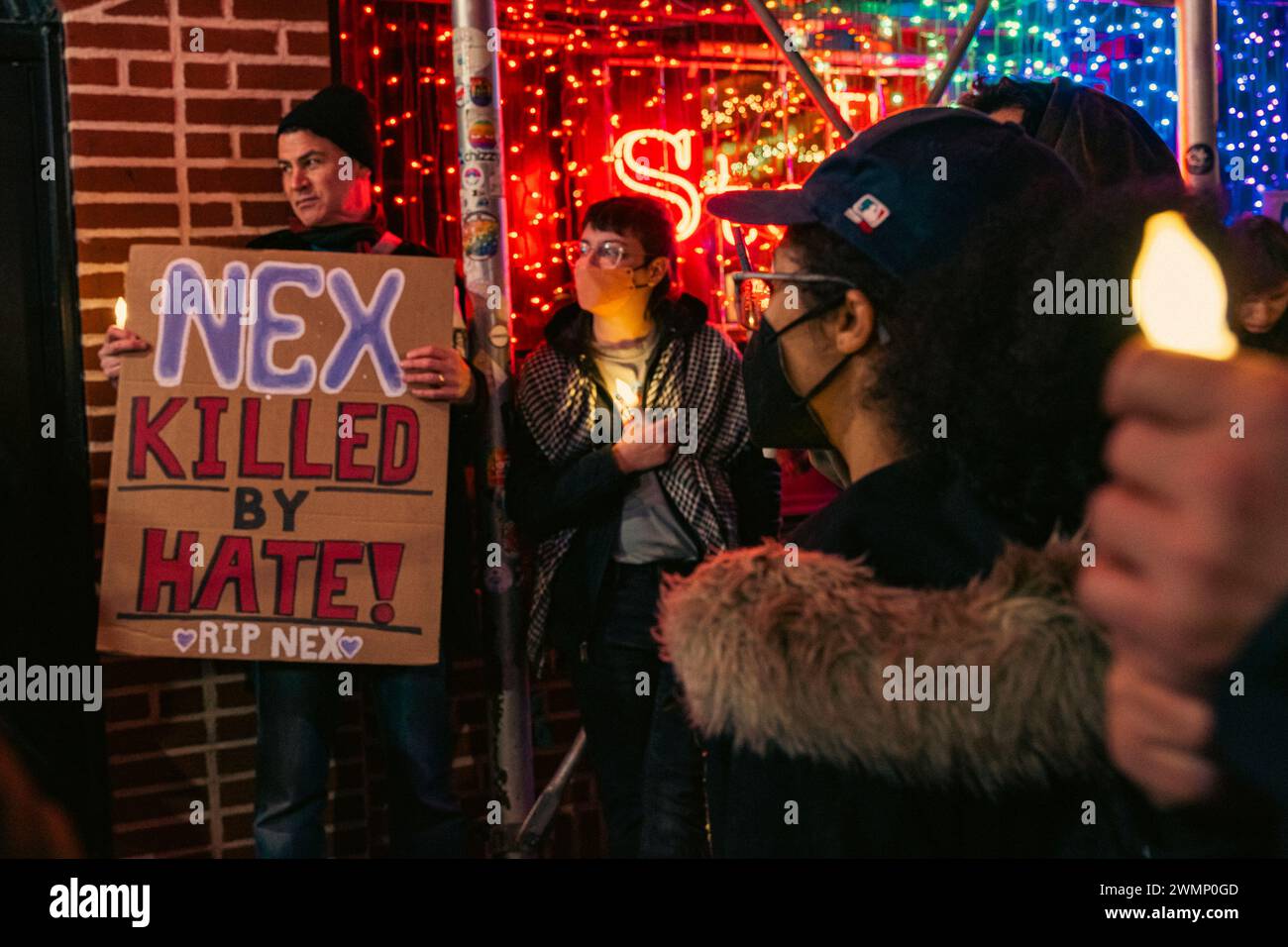 People hold a vigil outside The Stonewall Inn to mourn the death of ...
