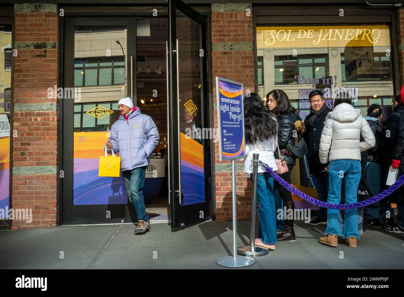 Hundreds line up for free samples and drinks at a Sol de Janeiro brand activation in the Meatpacking District in New York on Tuesday, February 20, 2024. The pop-up is part of the body and hair care brand’s promotional activities. (© Richard B. Levine) Stock Photo