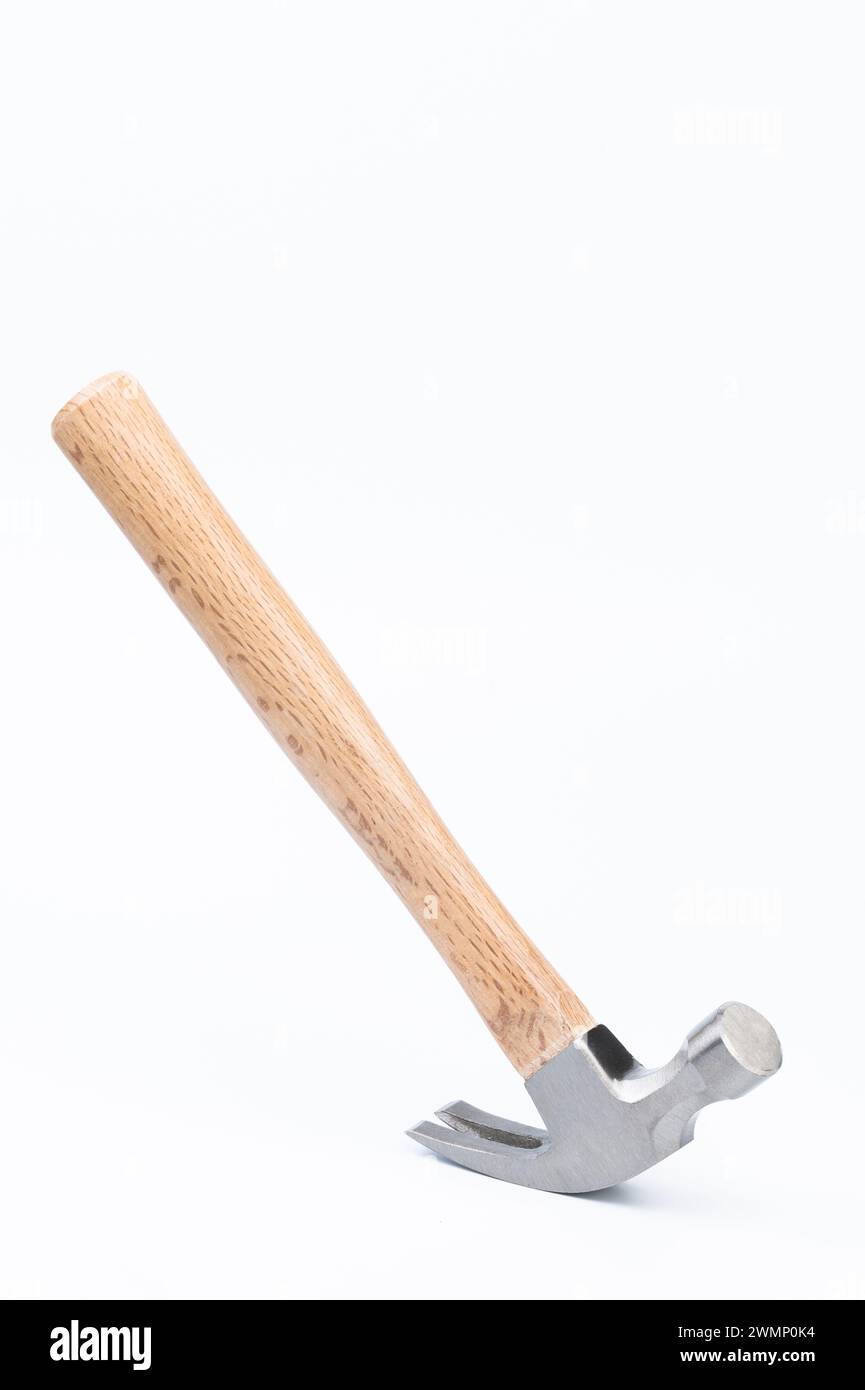 Hammer with wooden handle stand on head isolated on white studio background Stock Photo