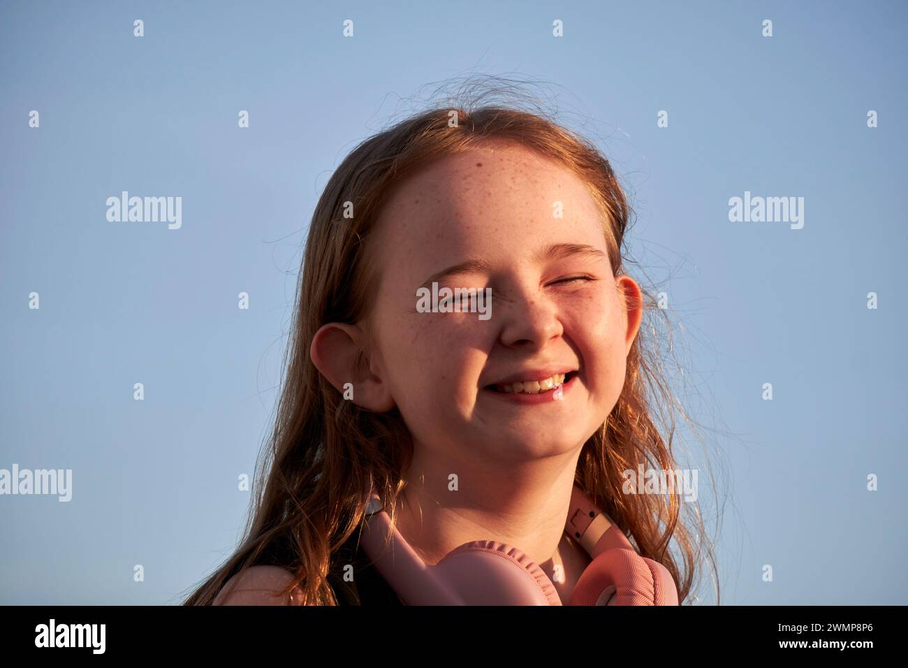 young 10 year old girl smiling laughing at sunset Lanzarote, Canary Islands, spain Stock Photo