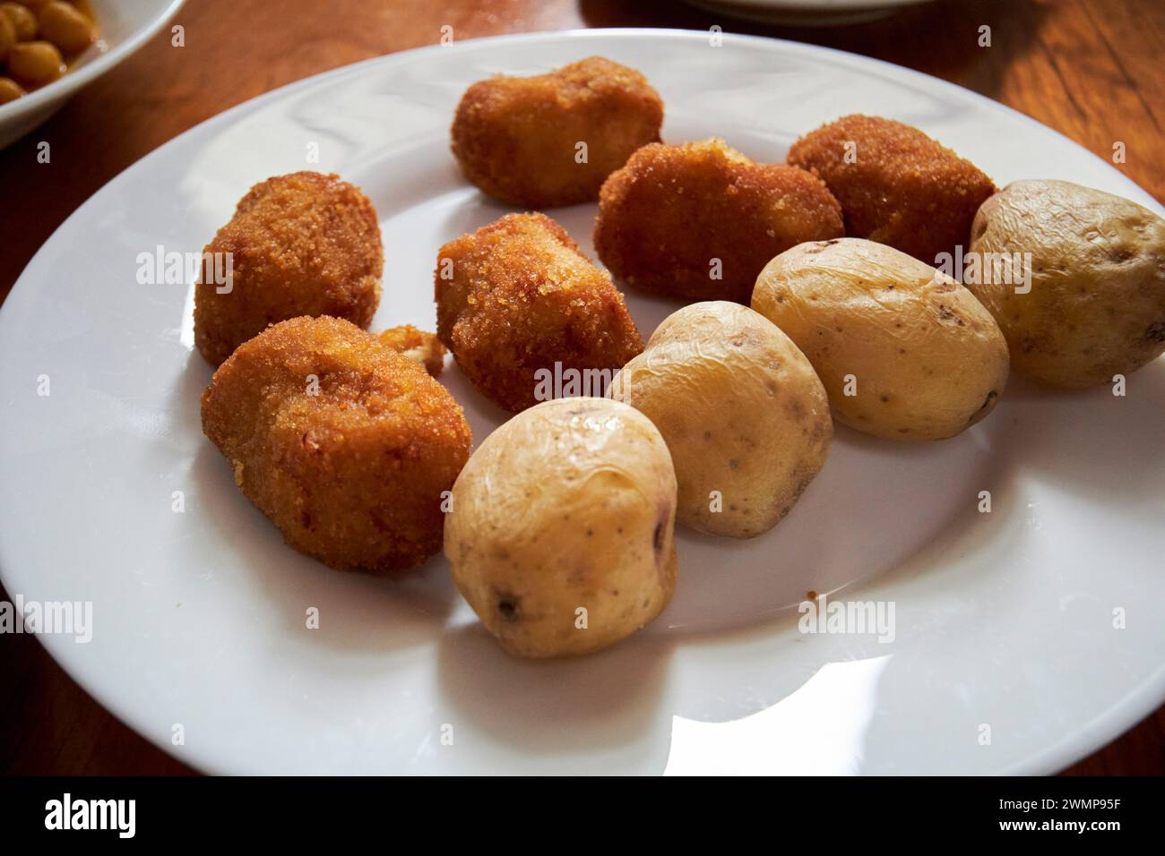 canarian potatoes papas arrugadas and canarian potato croquettes served as tapas Yaiza, Lanzarote, Canary Islands, spain Stock Photo