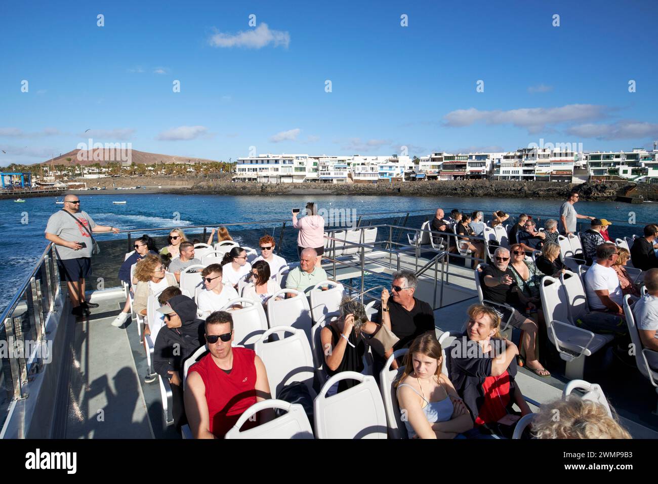 passengers tourists and day trippers on the lineas romero fast ferry from playa blanca, Lanzarote, to corralejo fuerteventura Canary Islands, spain Stock Photo