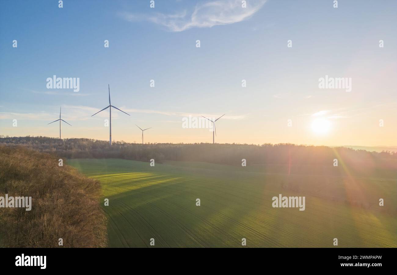An aerial view of wind turbines in a green field in Giessen, Germany Stock Photo