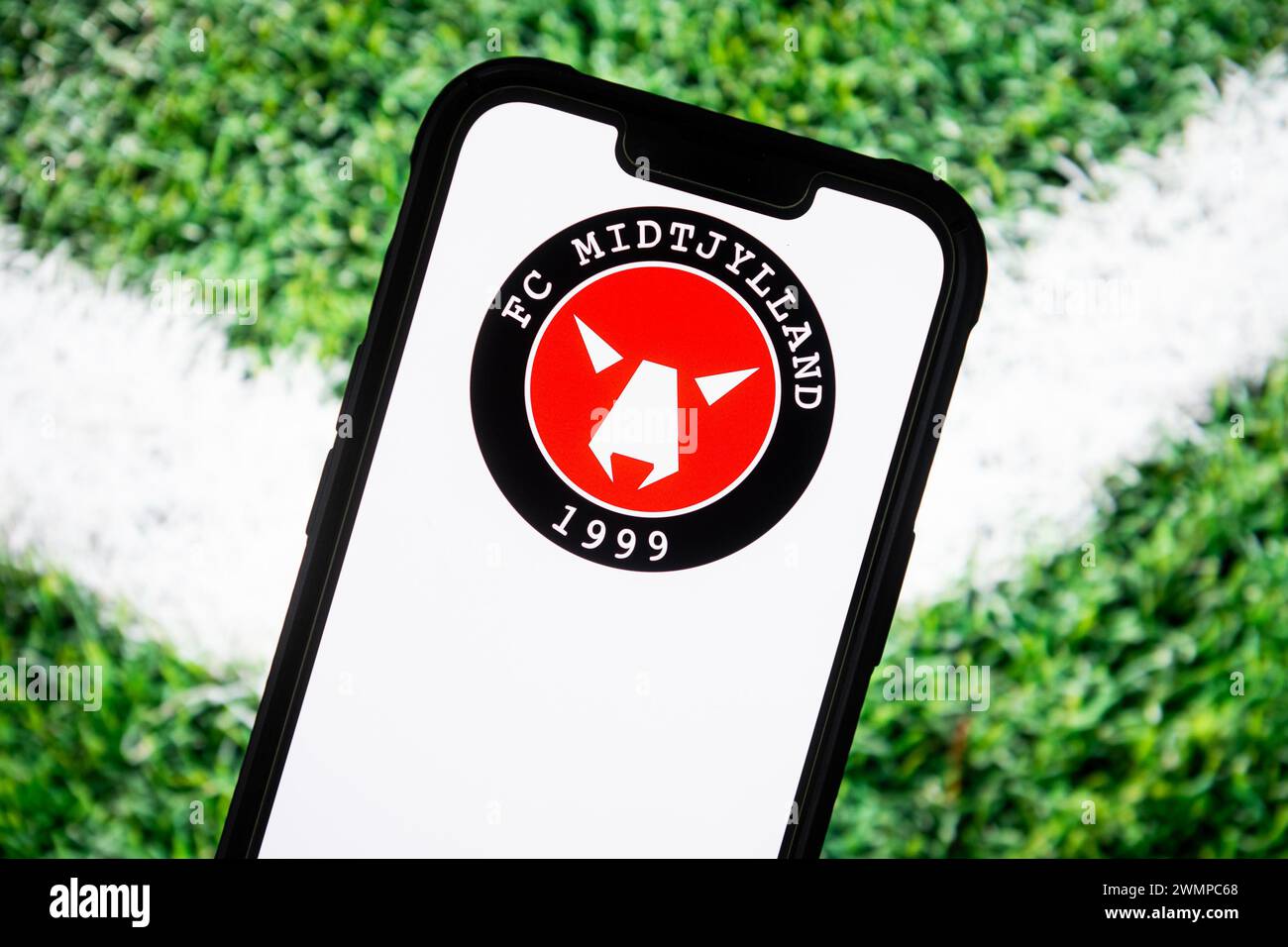 In this photo illustration, the FC Midtjylland football club logo seen displayed on a smartphone. Stock Photo