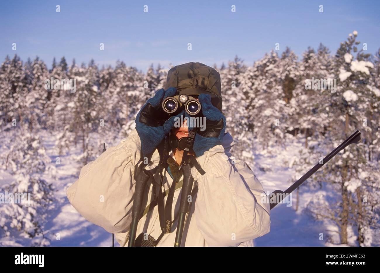 Hunter with binoculars Stock Photo