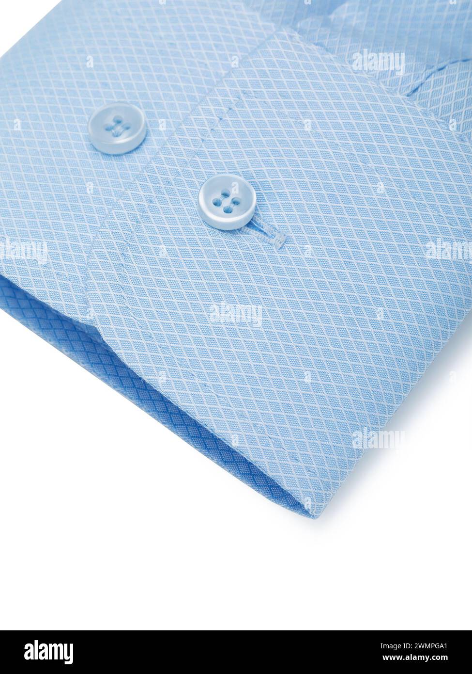 Cuff of a light blue shirt with buttons on a white background close-up ...