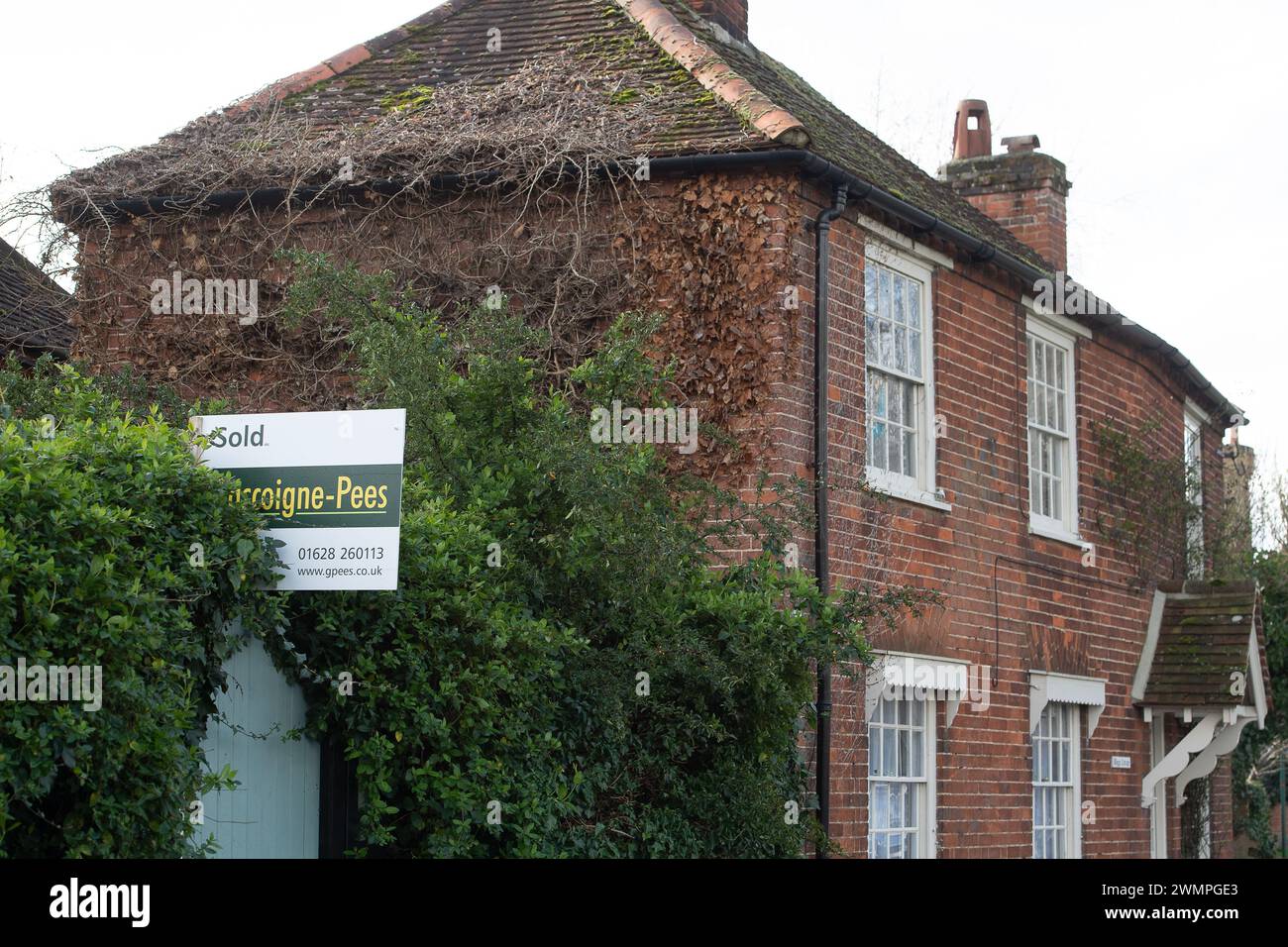 Cookham, Berkshire, UK. 26th February, 2024. A sold sign outside a house in the village of Cookham, Berkshire. Property prices are starting to stablise again after a fall in prices. Credit: Maureen McLean/Alamy Stock Photo